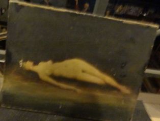 Femme nue couchée au bord de l'eau
