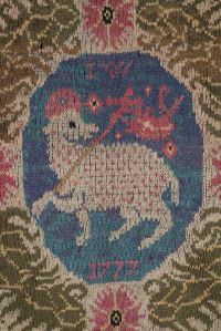 tapis tricoté à l'agneau pascal provenant de la corporation des bonnetiers de Colmar